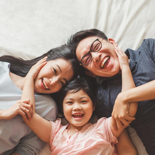 Family smiling after getting dental treatment at KZoo Family Dental in Kalamazoo, MI