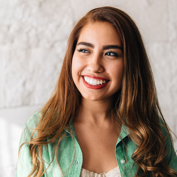 Woman happy after a teeth whitening procedure in Kalamazoo, MI